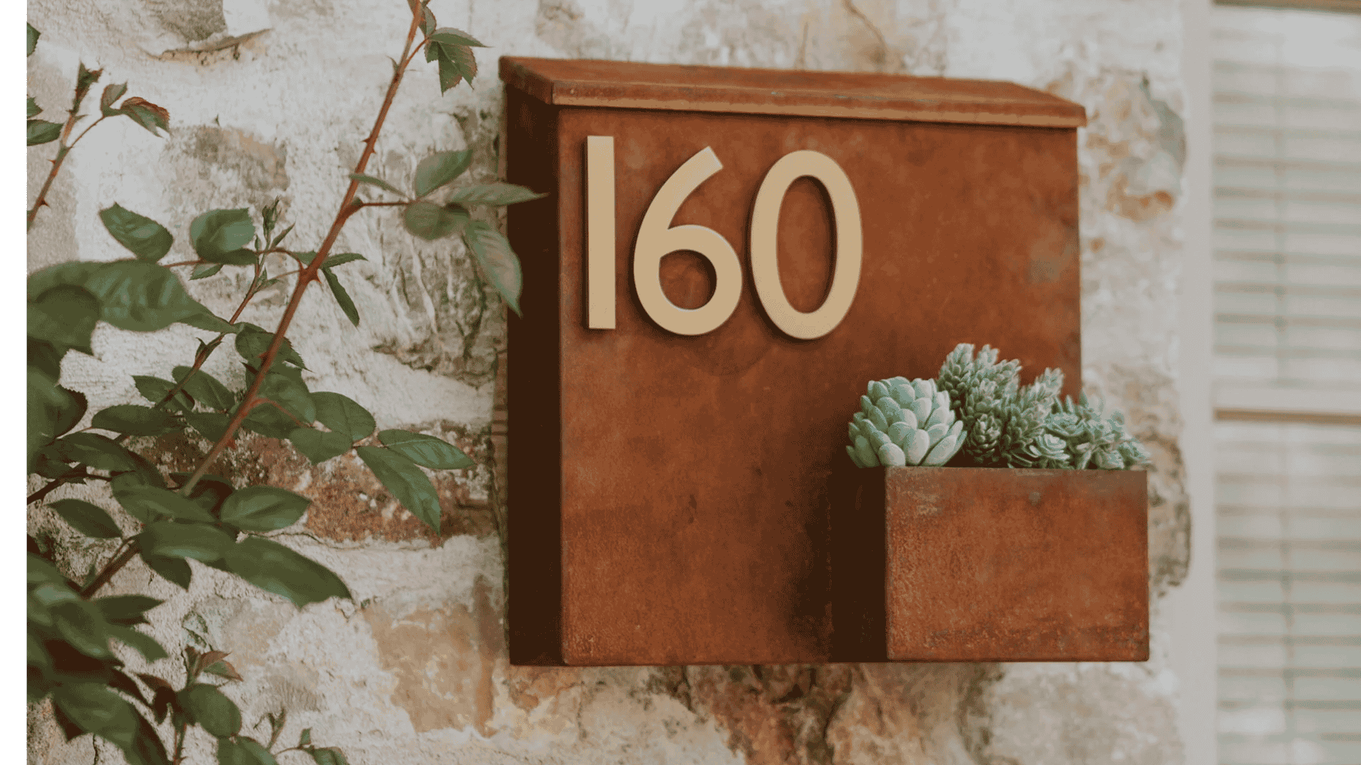 Smart Placements For Outdoor House Numbers In Tight Entries by Post & Porch, featuring a wall-mount mailbox and fake succulents