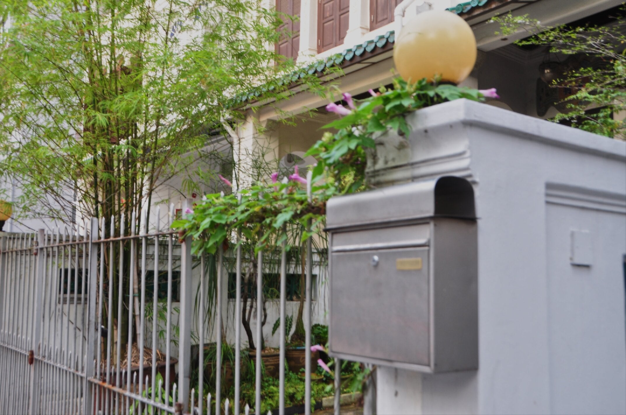 silver mailbox on property wall